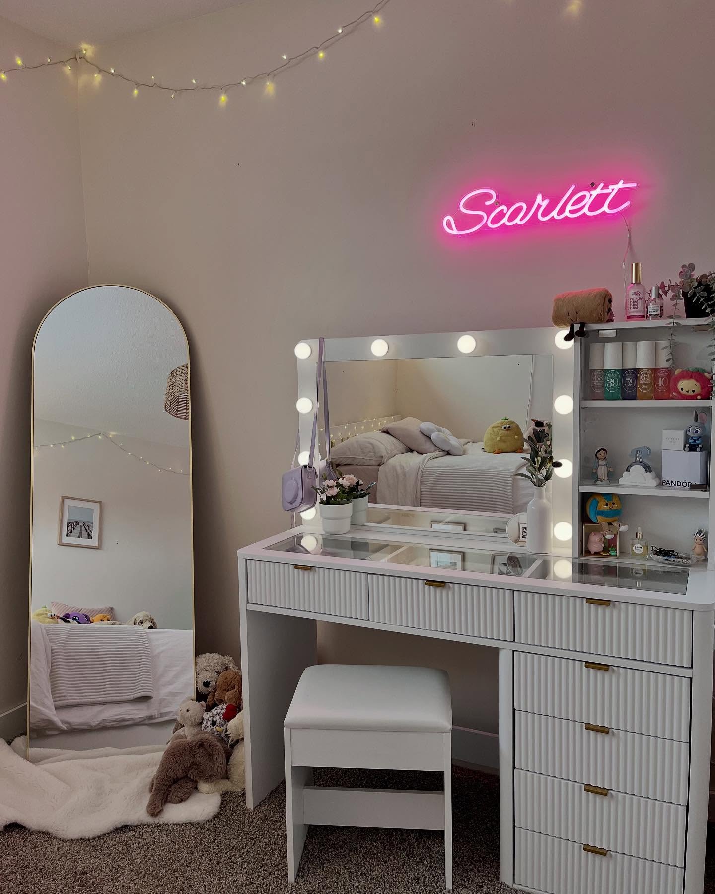 Girls bedroom vanity corner with glow lighting and a small neon sign above the mirror