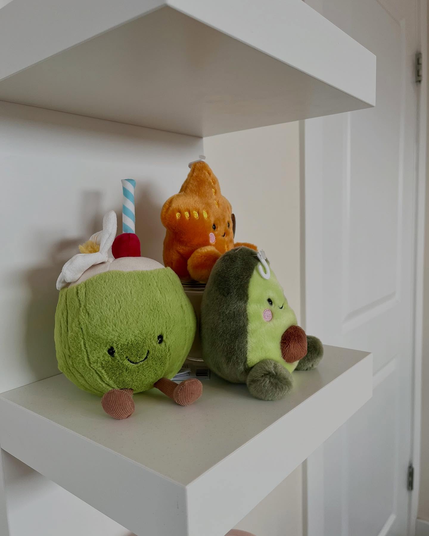 Close view of a shelf with stuffed toys in a Winnipeg girls bedroom