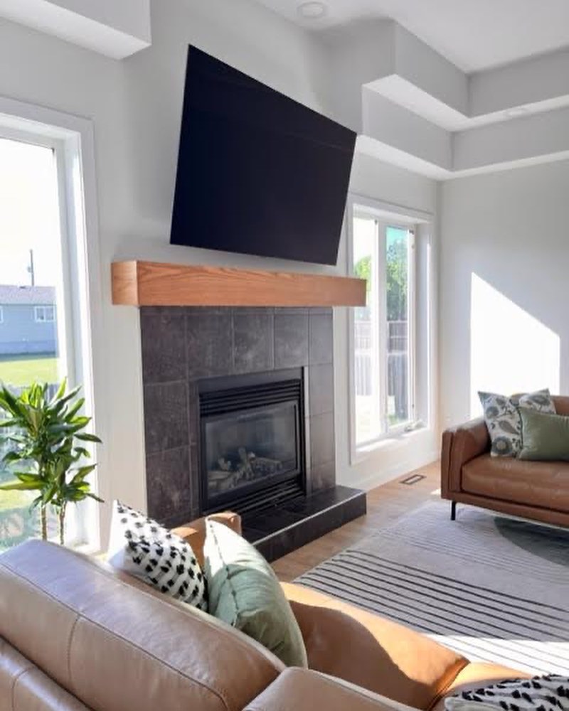 Detail of crown, paint, and mantle styling in a Winnipeg living room