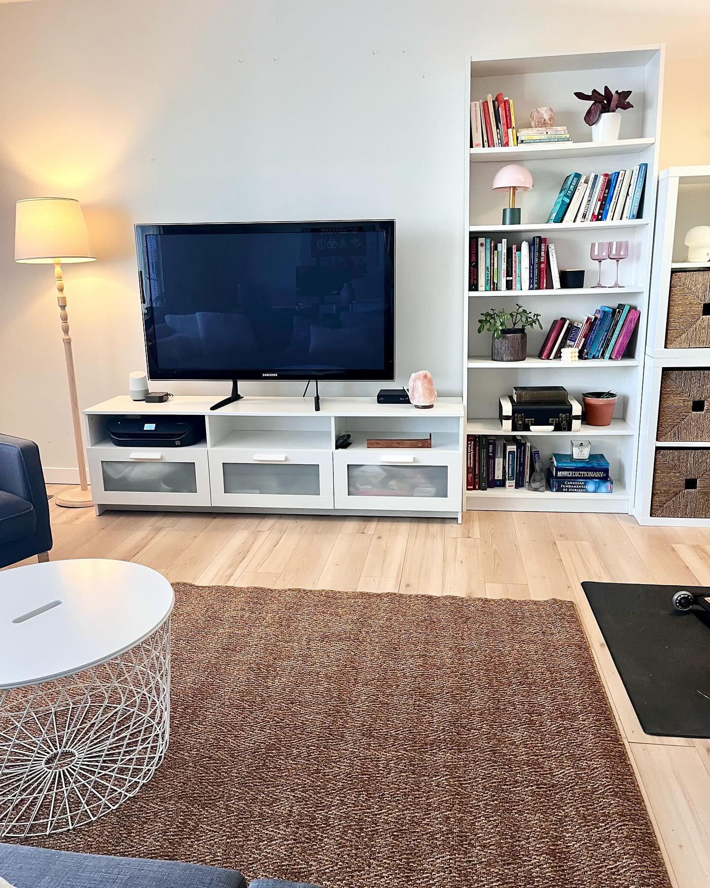 Living room corner with lamp, plants, and textiles restyled without renovation